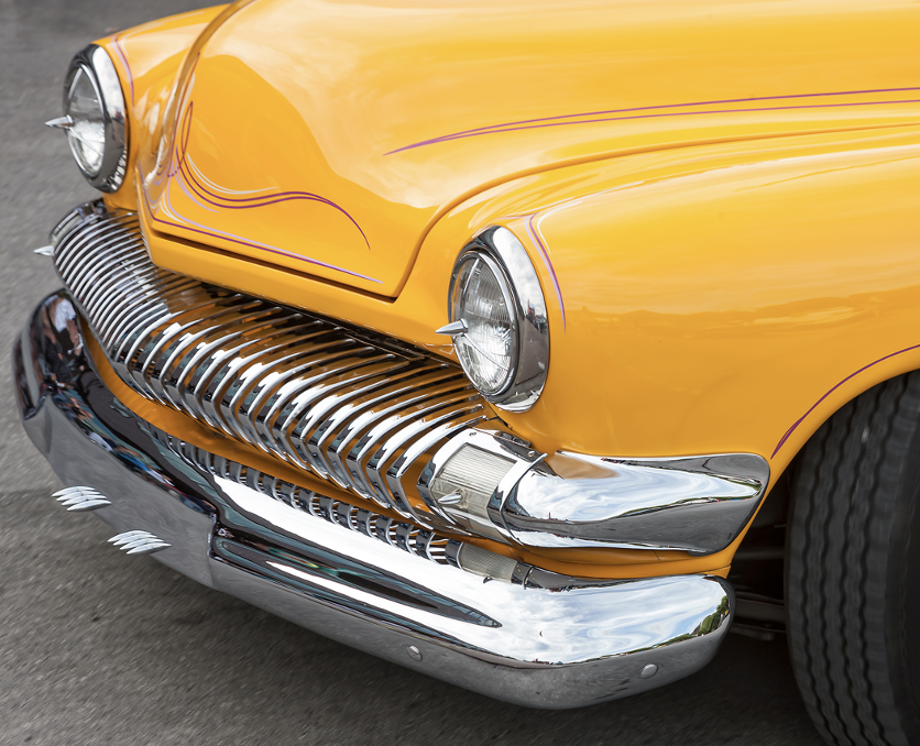 The front of a vintage car